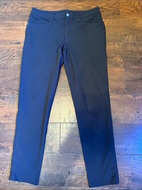 Lululemon ABC pants in 32W 30.5L in dark gunmetal gray color.